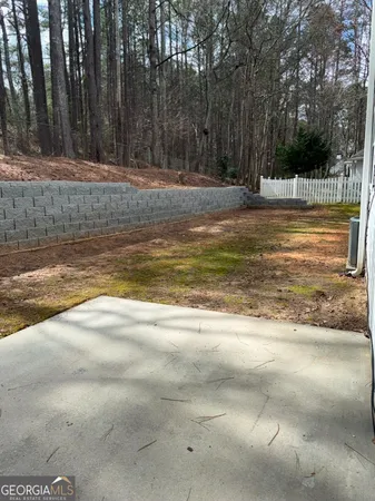 a view of a swimming pool with a yard