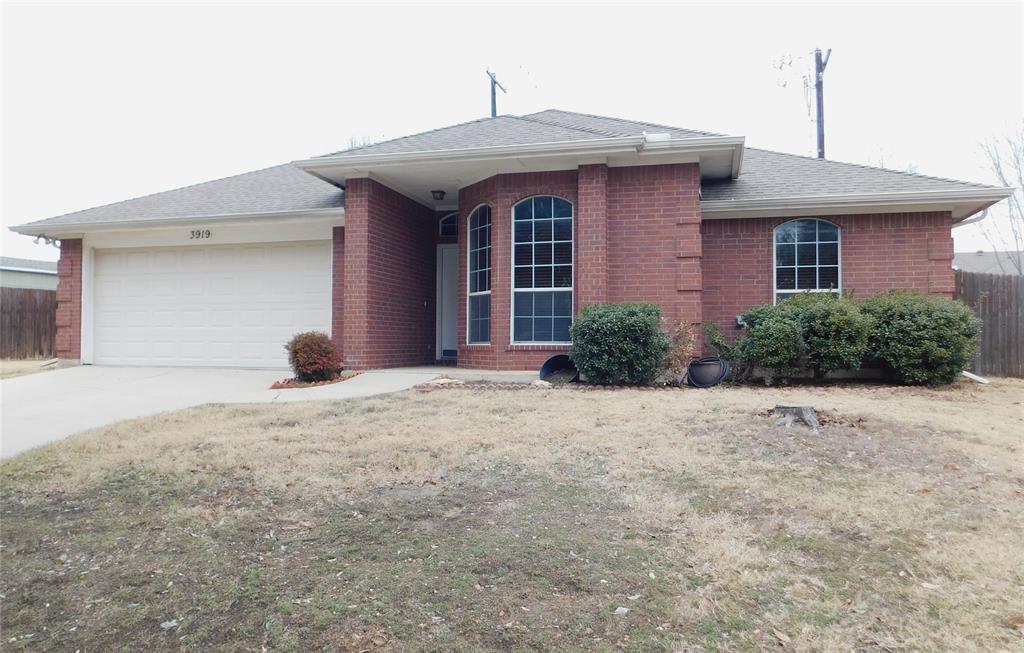 3919 Canton Court Denton, TX 76208 - Photo 2 of 26 a front view of a house with a yard