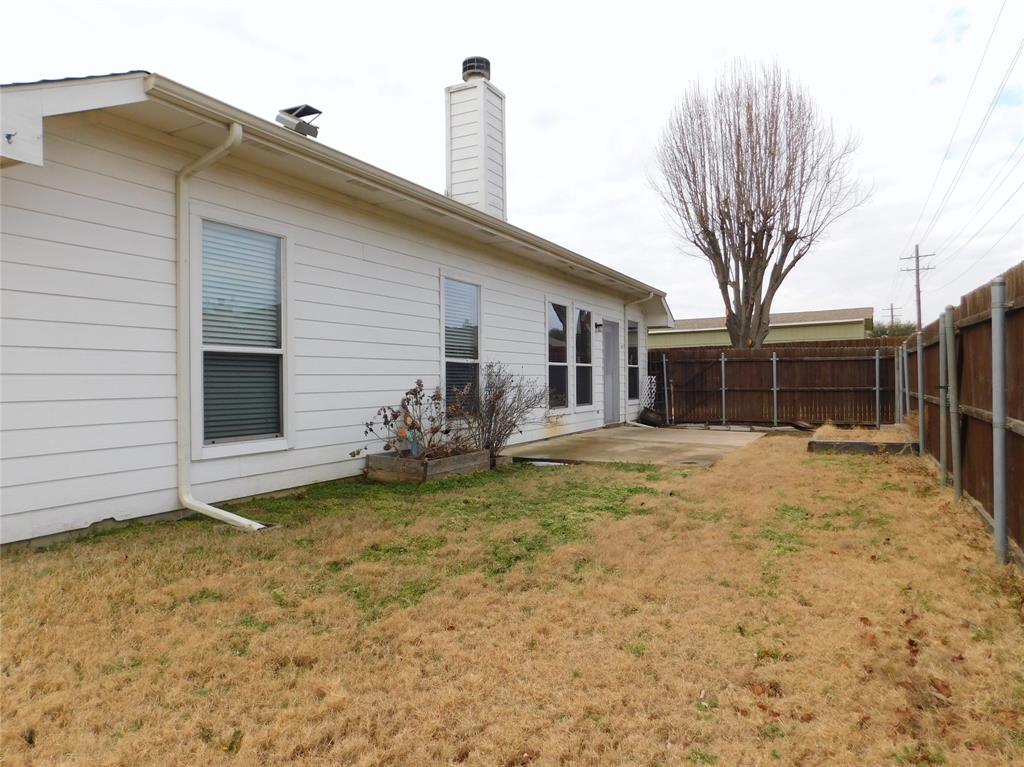 3919 Canton Court Denton, TX 76208 - Photo 25 of 26 a view of a house with a yard