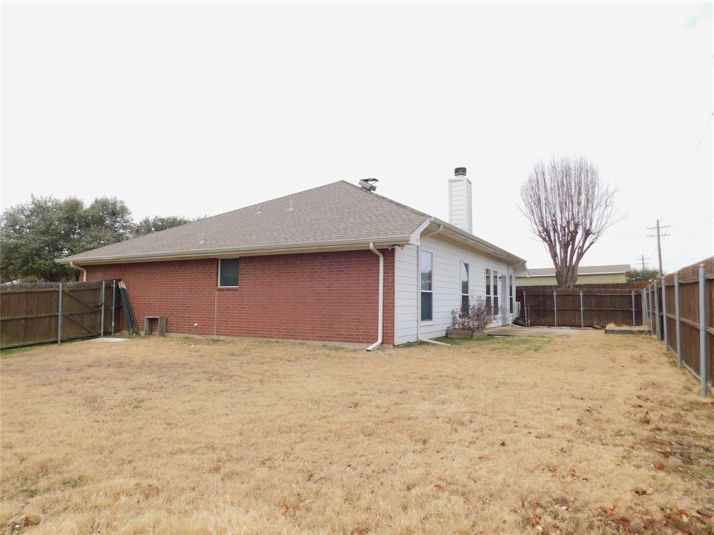 3919 Canton Court Denton, TX 76208 - Photo 26 of 26 a house that has a tree in front of it