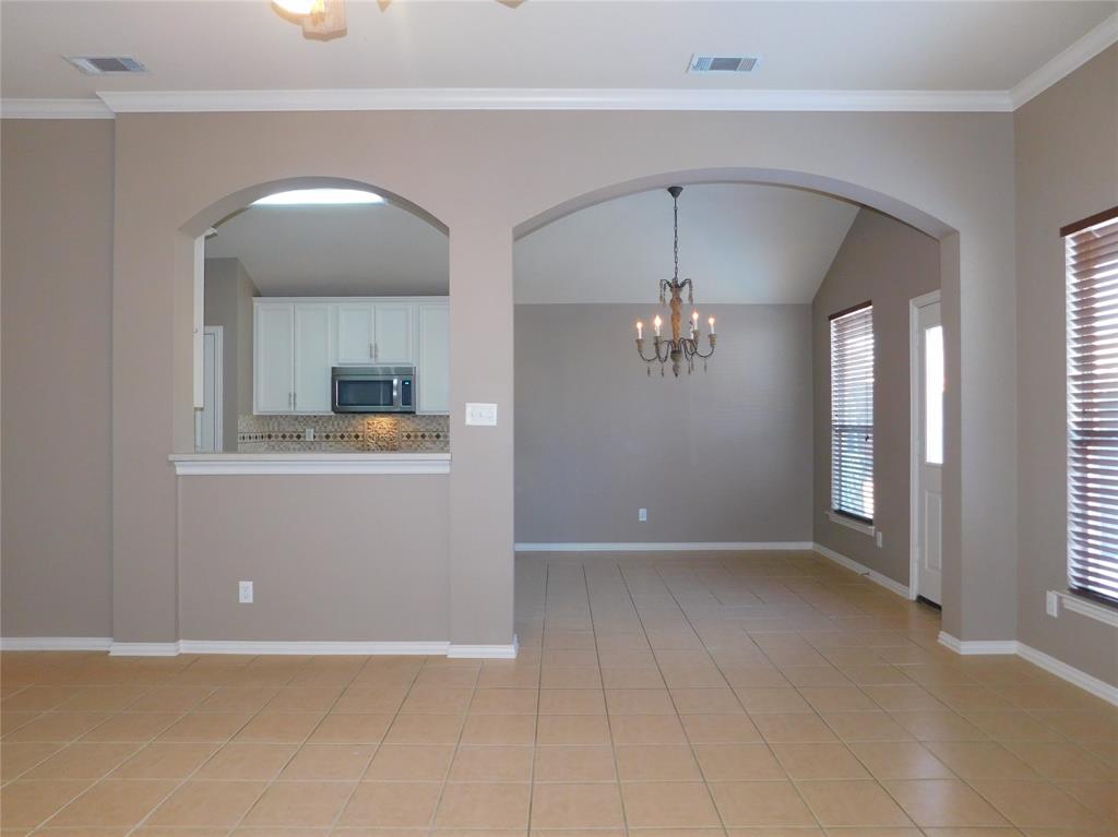 3919 Canton Court Denton, TX 76208 - Photo 7 of 26 a view of a kitchen with a sink and cabinet area