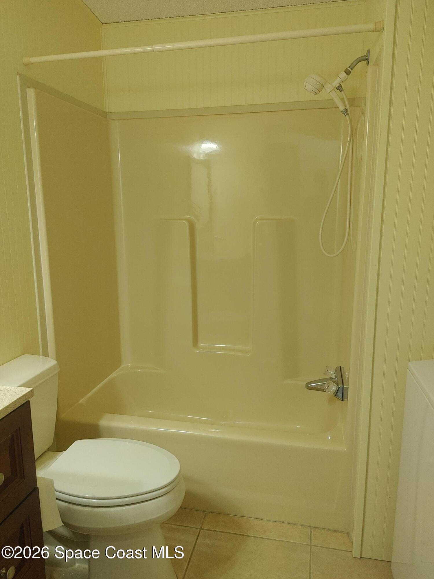 7629 Chasta Road Micco, FL 32976 - Photo 14 of 16 a bathroom with a toilet and a shower