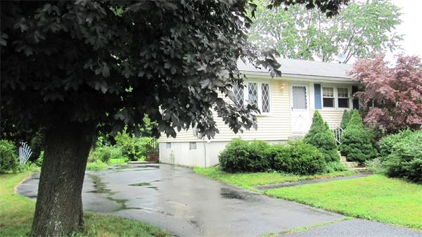18 Robin Road Westborough, MA 01581 - Photo 11 of 15 a front view of a house with a yard and a garage