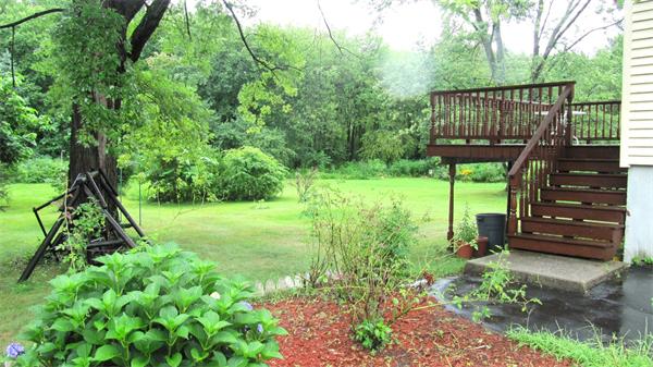 18 Robin Road Westborough, MA 01581 - Photo 2 of 15 a view of a deck in front of house with a yard