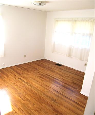 18 Robin Road Westborough, MA 01581 - Photo 6 of 15 a view of empty room with wooden floor and fan