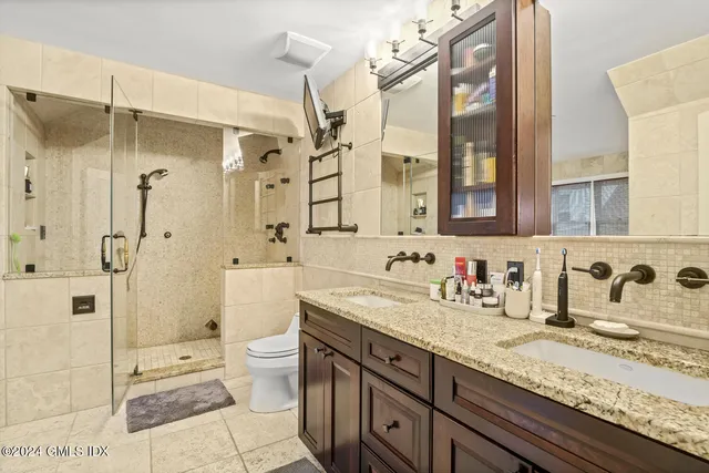 a view of balcony with wooden fence