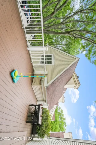 swimming pool view with a seating space