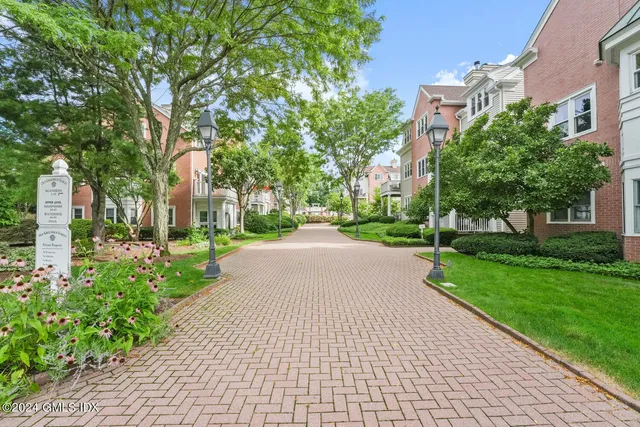 a view of a porch with furniture and garden