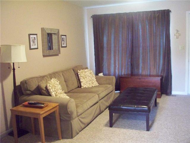 2012 Ridgecrest Circle Dickson, TN 37055 - Photo 5 of 20 Plenty of wall space in the living room for a full size couch and wall decorations. Curtains will remain and can be opened for a full view of the front lawn
