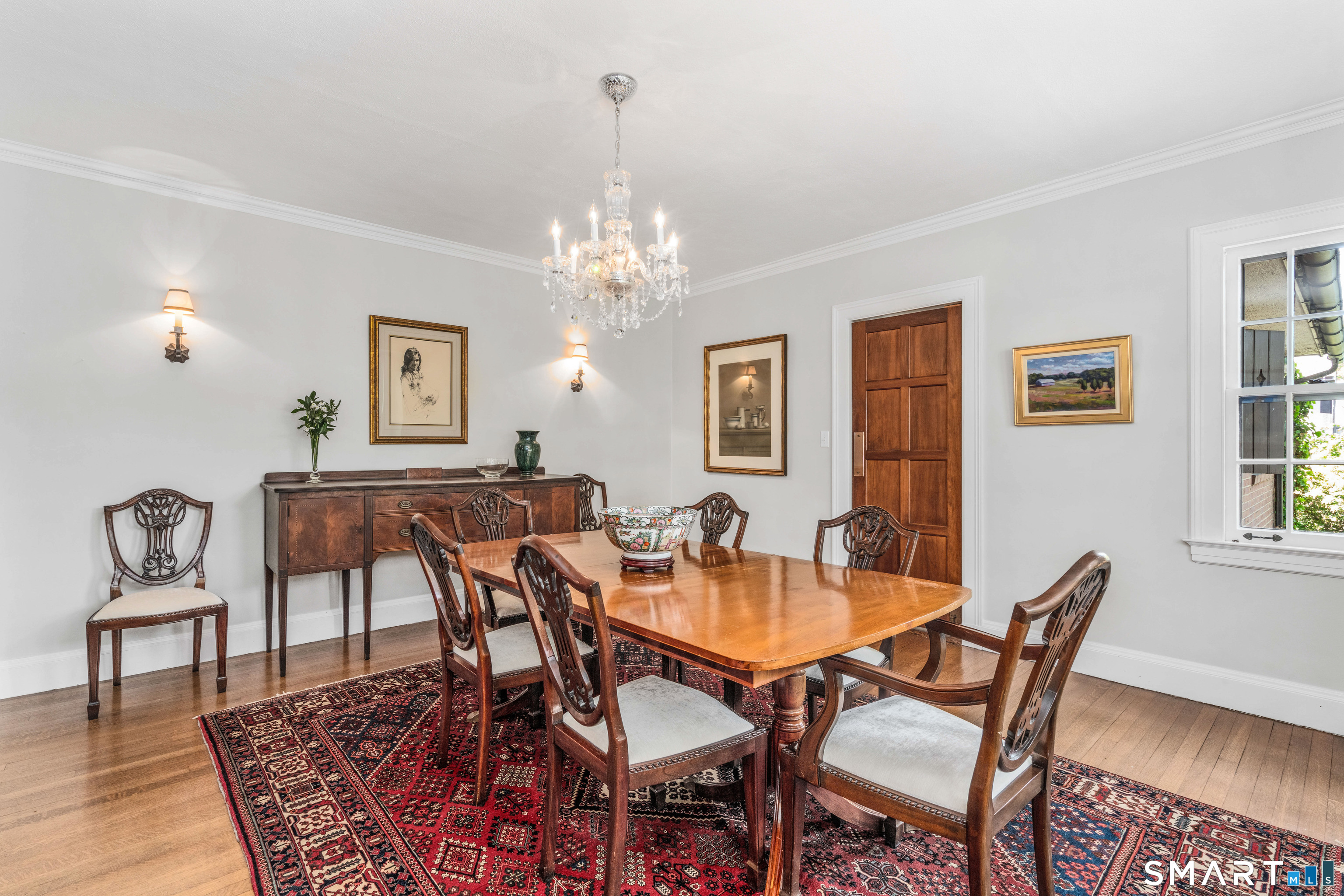 7 Fernwood Road West Hartford, CT 06119 - Photo 11 of 40 a view of a dining room with furniture and chandelier