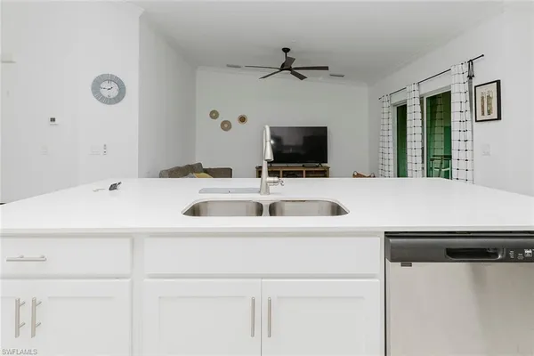 a kitchen with a sink and a refrigerator