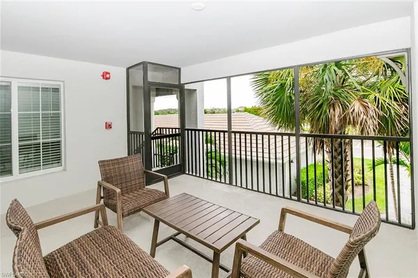 a view of a two chairs in the balcony