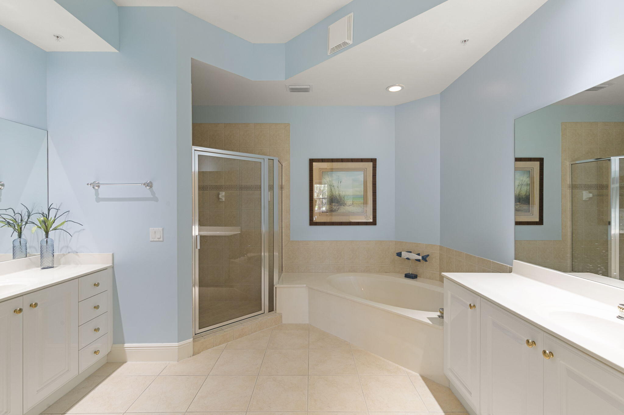 9066 Cascada Way, Unit 101 Naples, FL 34114 - Photo 19 of 51 a spacious bathroom with a tub sink a mirror and a shower