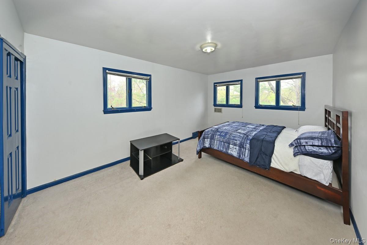 19 Sterling Road Spring Valley, NY 10977 - Photo 10 of 20 a bedroom with a bed and a window