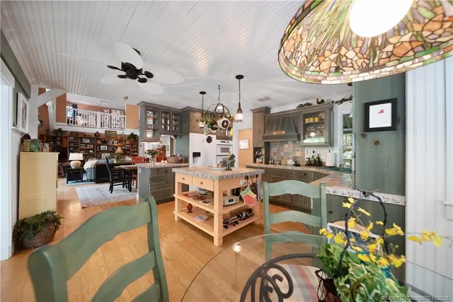 a large kitchen with stainless steel appliances lots of counter top space