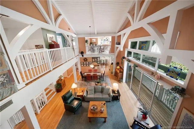 a view of a chairs and table in a patio and a balcony