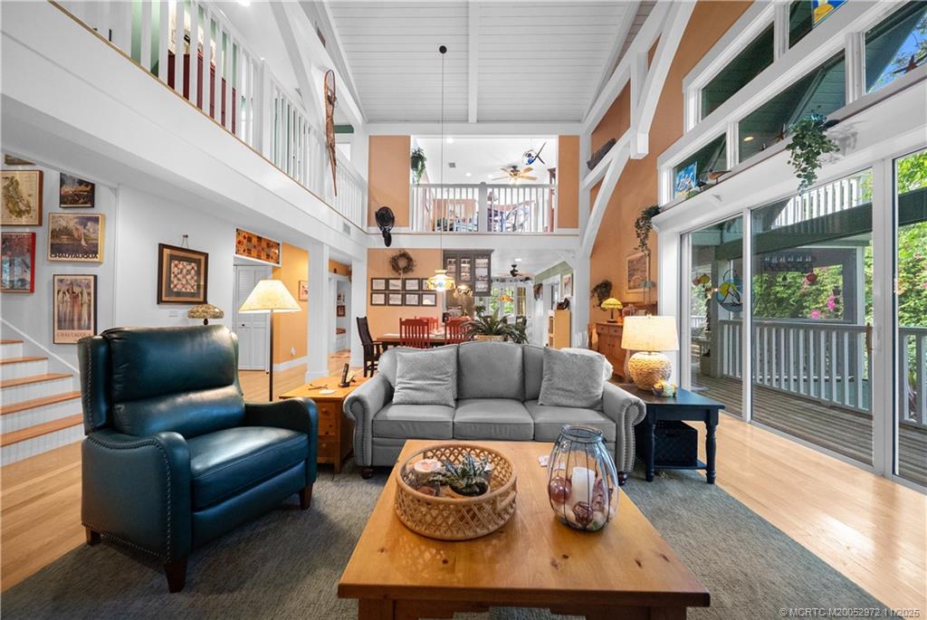 12 Oak Hill Way Stuart, FL 34996 - Photo 23 of 63 a living room with furniture and a chandelier