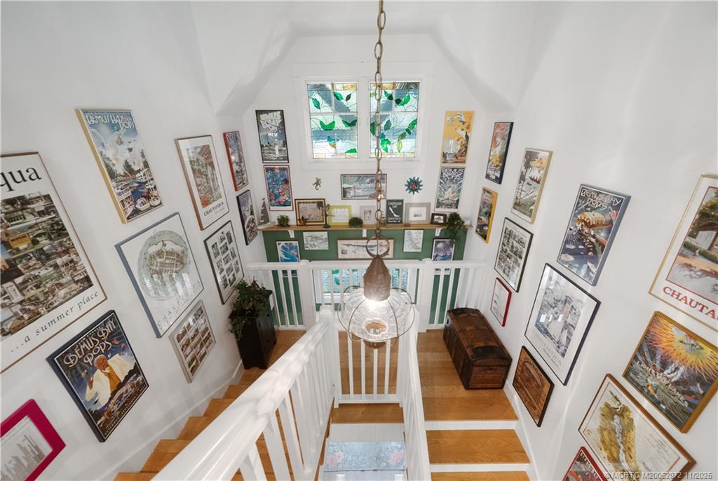 12 Oak Hill Way Stuart, FL 34996 - Photo 24 of 63 a view of living room with furniture and a chandelier