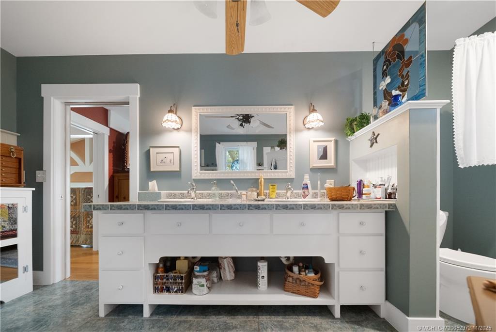 12 Oak Hill Way Stuart, FL 34996 - Photo 32 of 63 a kitchen with a sink cabinets and stainless steel appliances