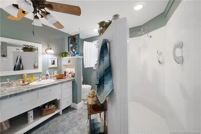 a view of living room kitchen with furniture and wooden floor