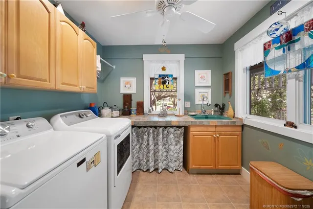 a living room with furniture rug and a window