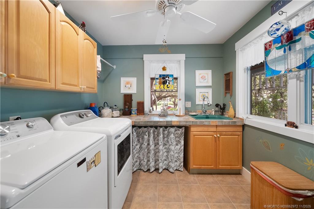 12 Oak Hill Way Stuart, FL 34996 - Photo 35 of 63 a kitchen that has a sink and a stove in it