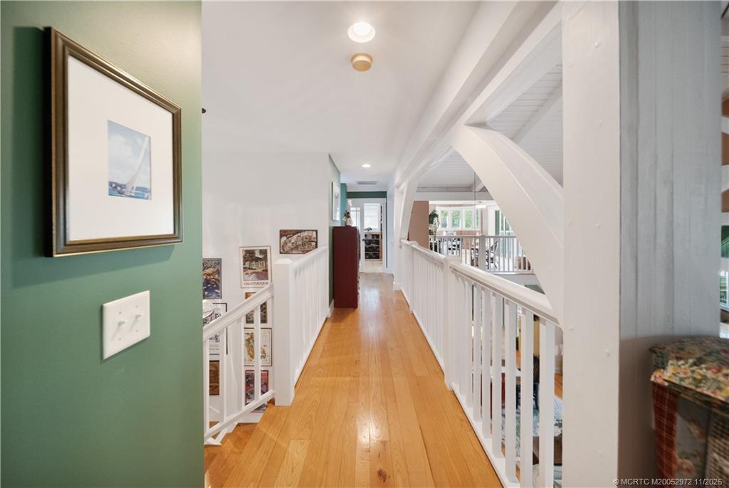 12 Oak Hill Way Stuart, FL 34996 - Photo 38 of 63 a view of a hallway with wooden floor and staircase