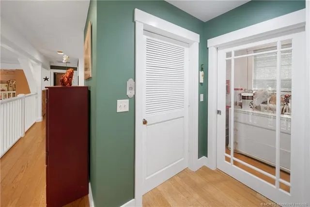 a spacious bedroom with a bed and a dresser