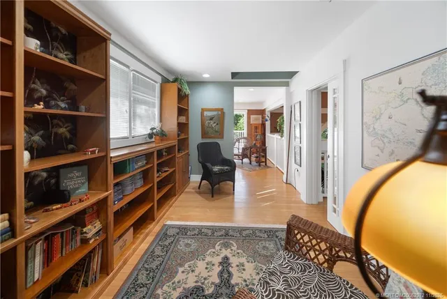 a bedroom with furniture and a window