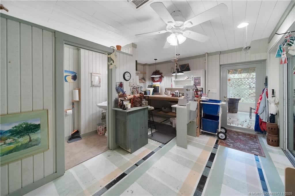 12 Oak Hill Way Stuart, FL 34996 - Photo 45 of 63 a view of a workspace with furniture and a livingroom