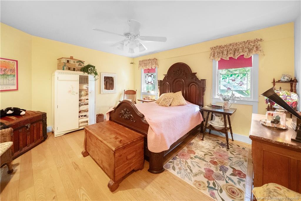 12 Oak Hill Way Stuart, FL 34996 - Photo 48 of 63 a spacious bedroom with a bed and a dresser