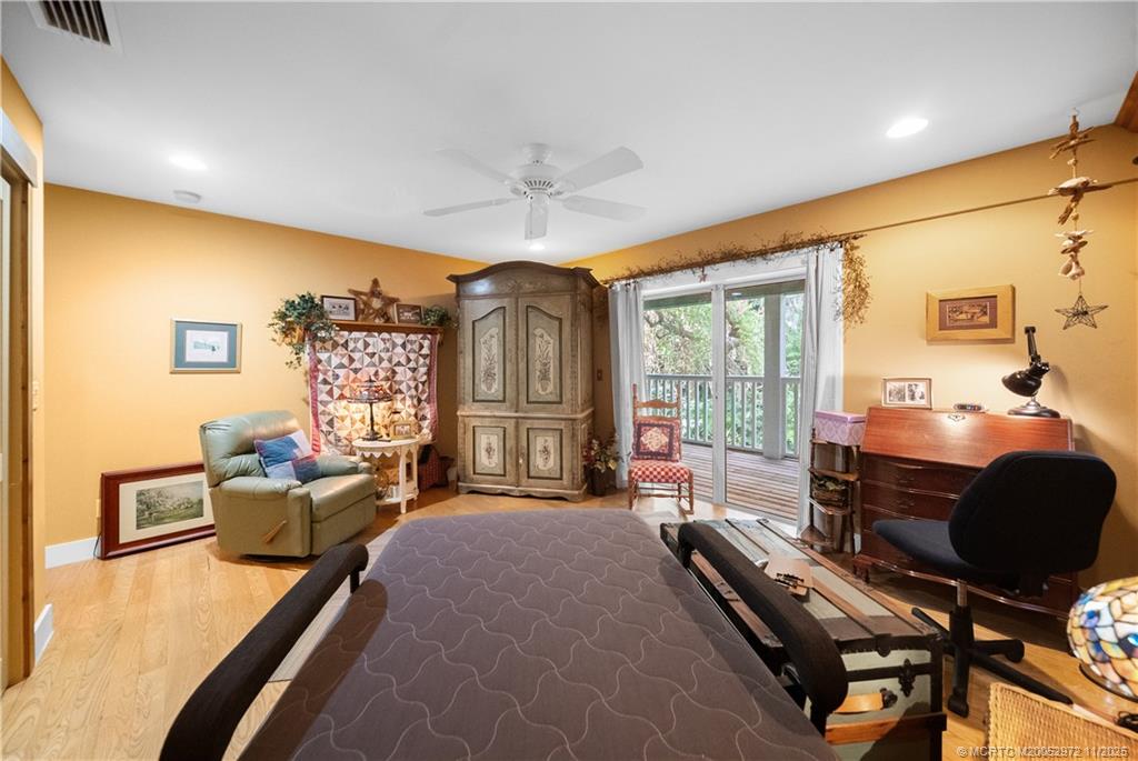 12 Oak Hill Way Stuart, FL 34996 - Photo 51 of 63 a bedroom with furniture and a window