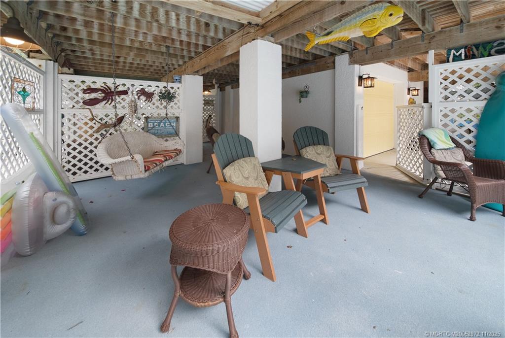 12 Oak Hill Way Stuart, FL 34996 - Photo 54 of 63 a living room with furniture and a large window