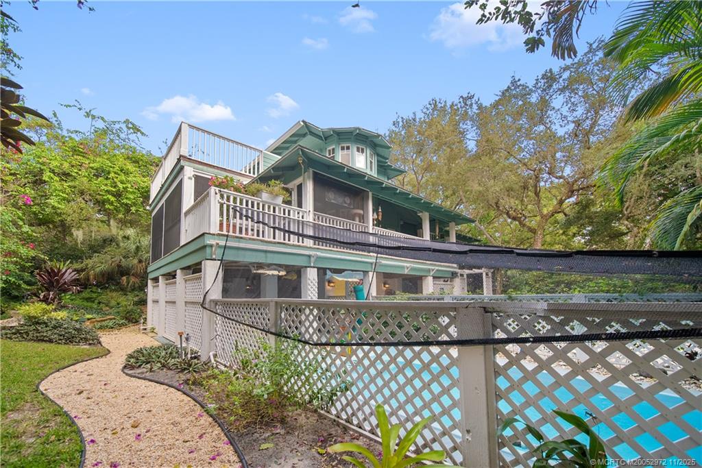 12 Oak Hill Way Stuart, FL 34996 - Photo 59 of 63 a front view of a house with a yard