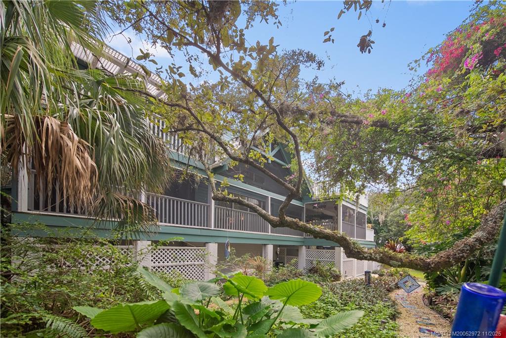 12 Oak Hill Way Stuart, FL 34996 - Photo 6 of 63 a front view of a house with garden