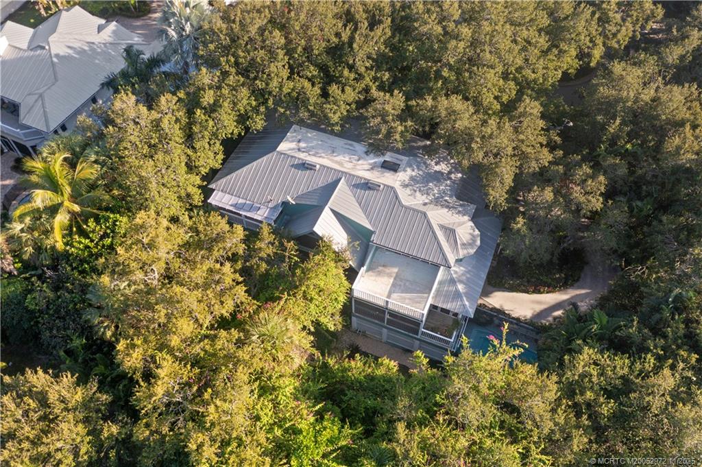 12 Oak Hill Way Stuart, FL 34996 - Photo 62 of 63 an aerial view of a house with a yard and garden