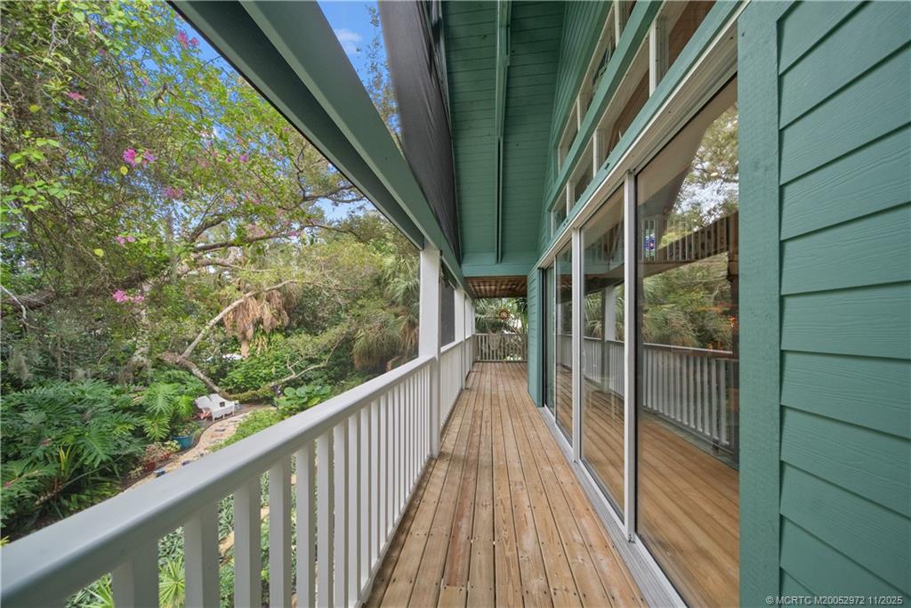 12 Oak Hill Way Stuart, FL 34996 - Photo 9 of 63 a view of balcony with wooden floor