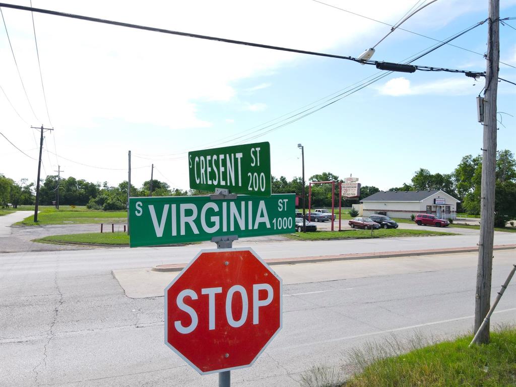 a view of a street with a yard