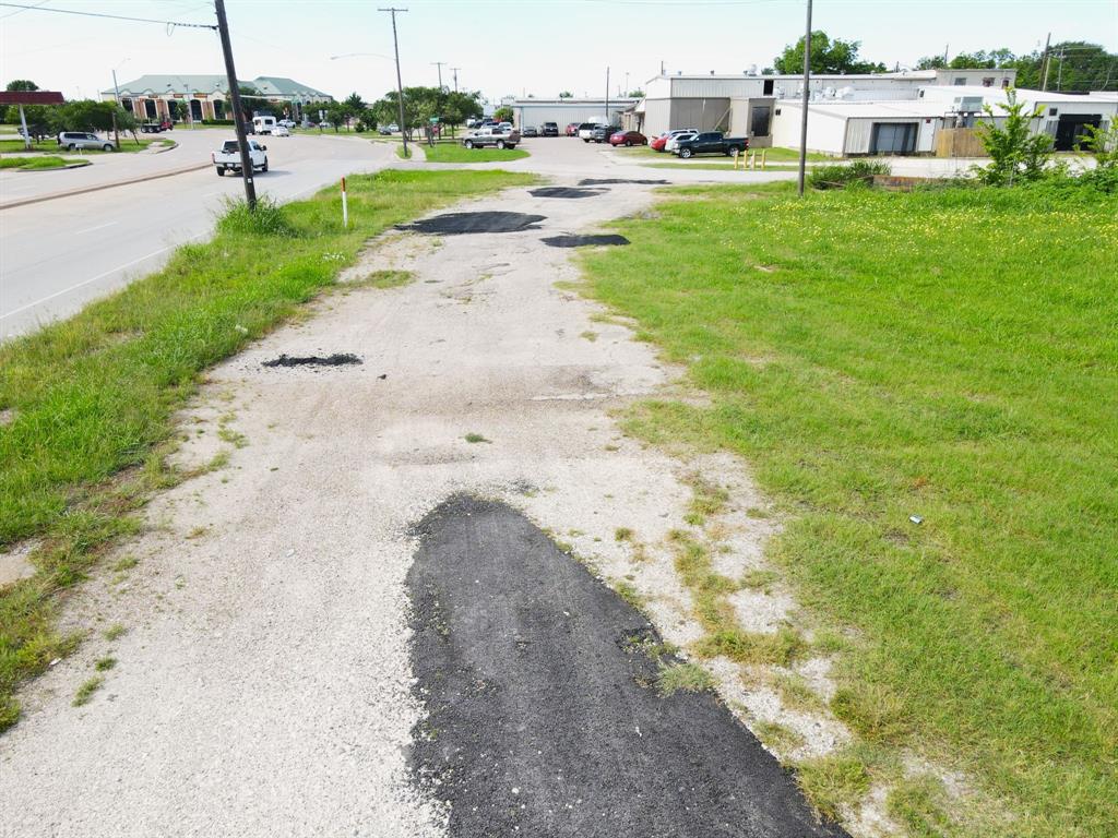 1008 South Virginia Street Terrell, TX 75160 - Photo 2 of 15 a view of a street with houses on both side of it