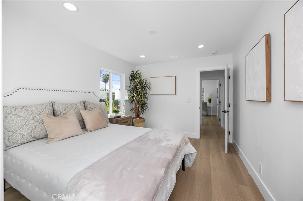 201 South Melrose Street Placentia, CA 92870 - Photo 28 of 35 a bedroom with a bed and a potted plant