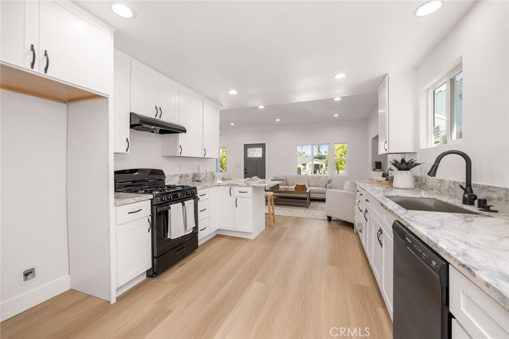 201 South Melrose Street Placentia, CA 92870 - Photo 4 of 35 a large kitchen with stainless steel appliances lots of counter space and a sink