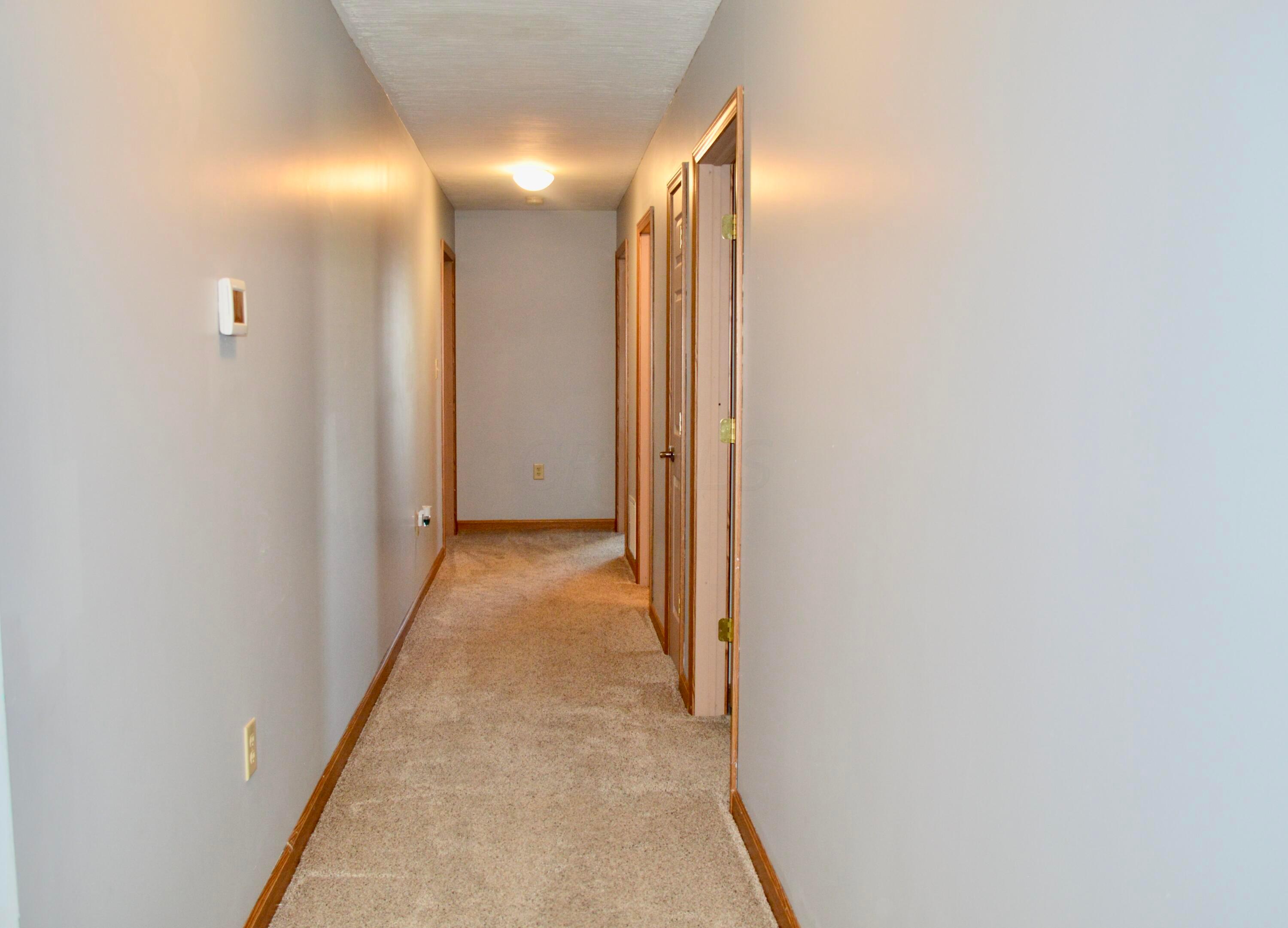 85 Barry Road Southwest Pataskala, OH 43068 - Photo 11 of 30 The hallway is extra wide leading to the Bedrooms...