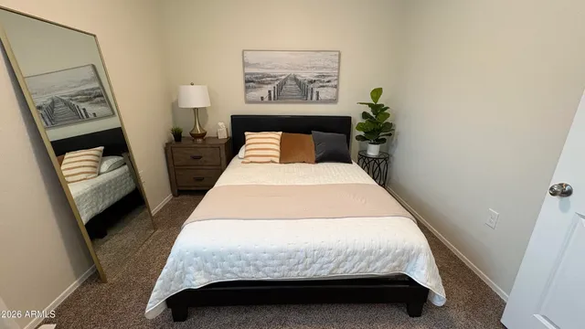 a view of a dining room with furniture and a chandelier