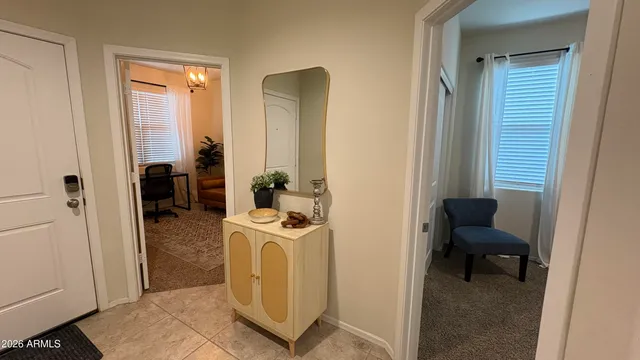 a bedroom with a bed and a chair