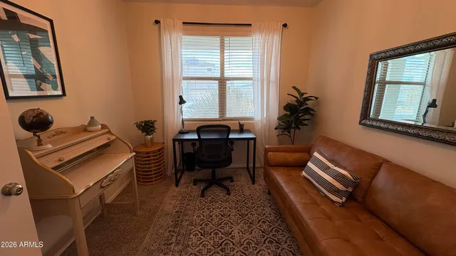 a bathroom with a granite countertop sink a mirror and a vanity
