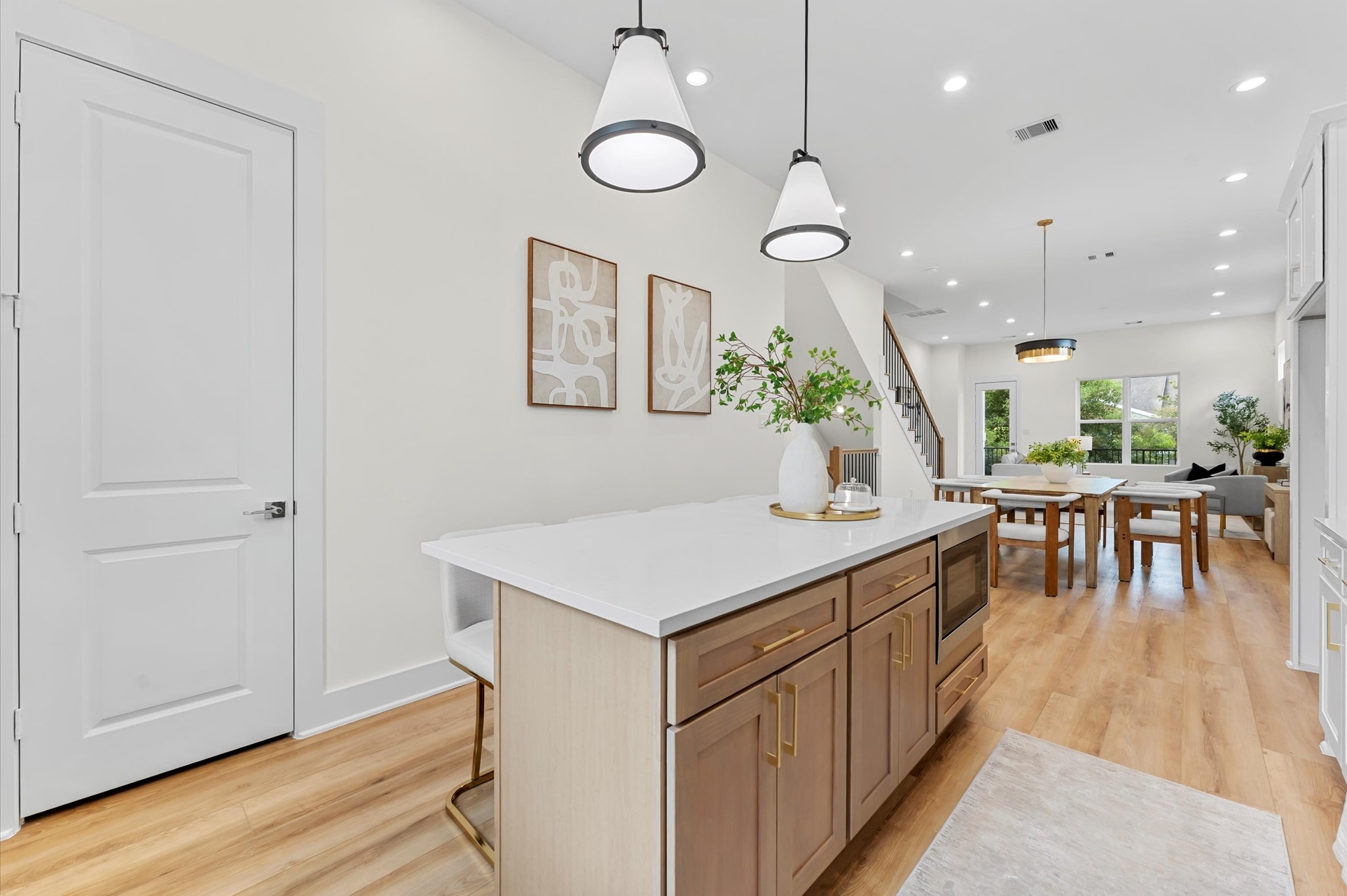 4129 De George Street Houston, TX 77009 - Photo 14 of 46 a kitchen with stainless steel appliances granite countertop a table and chairs