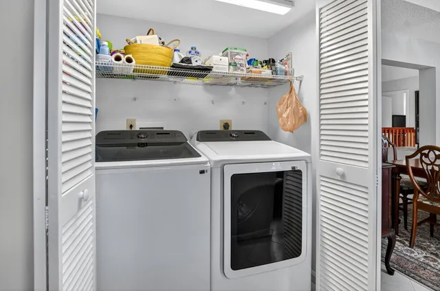 a utility room with dryer and washer