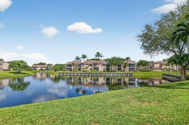a view of a lake with houses in the back