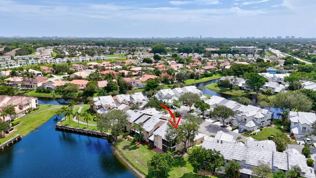 an aerial view of a houses with a lake view