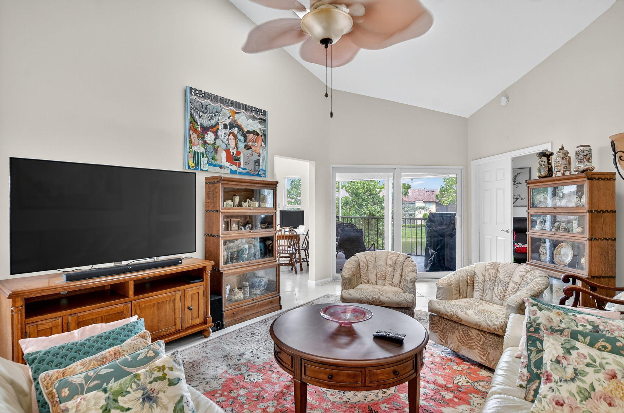 23181 Fountain View Drive, Unit B Boca Raton, FL 33433 - Photo 8 of 21 a living room with furniture and a flat screen tv